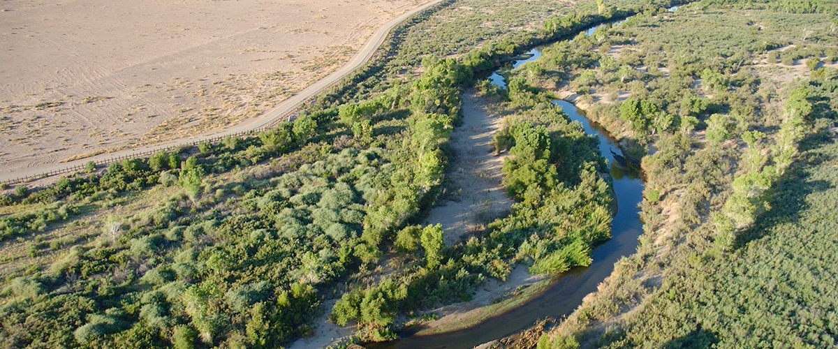 shrinking river running through dry lands