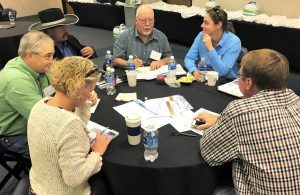 Workshop attendees participated in a simulation game to explore the different facets of pay for performance contracting. 